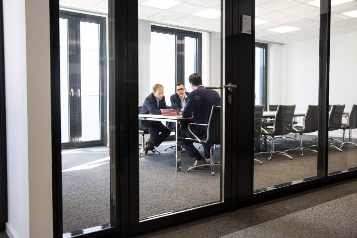 Geschäftliche Besprechung zum Forderungsmanagement bei Debtist